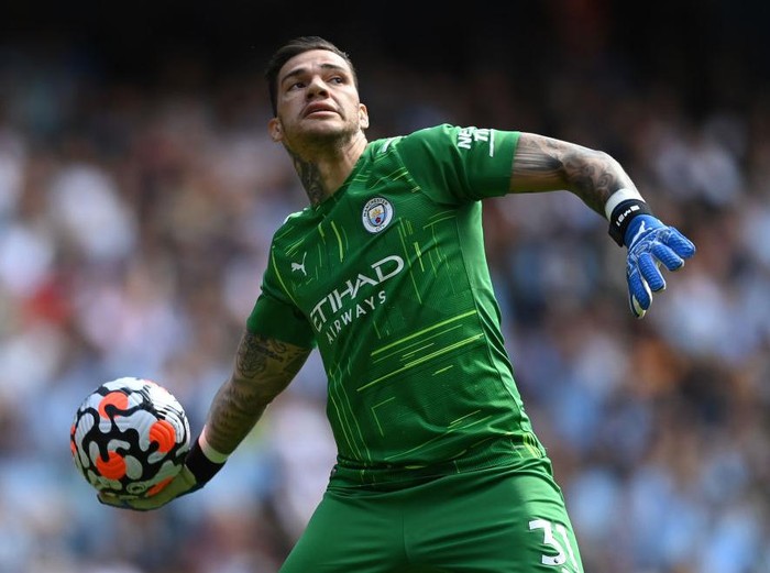 MANCHESTER, ENGLAND - JULY 26:  Ederson of Manchester City  holds the Golden Glove Award and Kevin De Bruyne of Manchester City holds the Playmaker Award  after the Premier League match between Manchester City and Norwich City at Etihad Stadium on July 26, 2020 in Manchester, England.Football Stadiums around Europe remain empty due to the Coronavirus Pandemic as Government social distancing laws prohibit fans inside venues resulting in all fixtures being played behind closed doors. (Photo by Shaun Botterill/Getty Images)