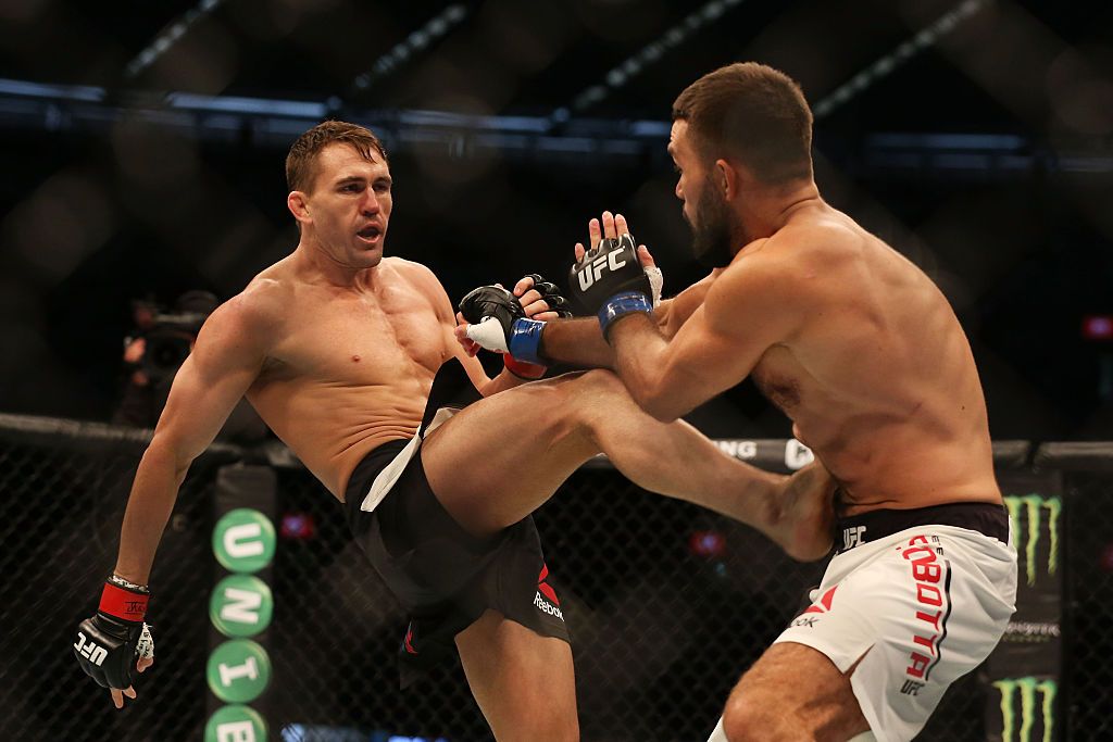 SYDNEY, AUSTRALIA - NOVEMBER 19:  Elias Theodorou (R) of Canada kicks Daniel Kelly (R) of Australia in their middleweight bout during the UFC Fight Night at Qudos Bank Arena on November 19, 2017 in Sydney, Australia.  (Photo by Mark Kolbe/Getty Images)