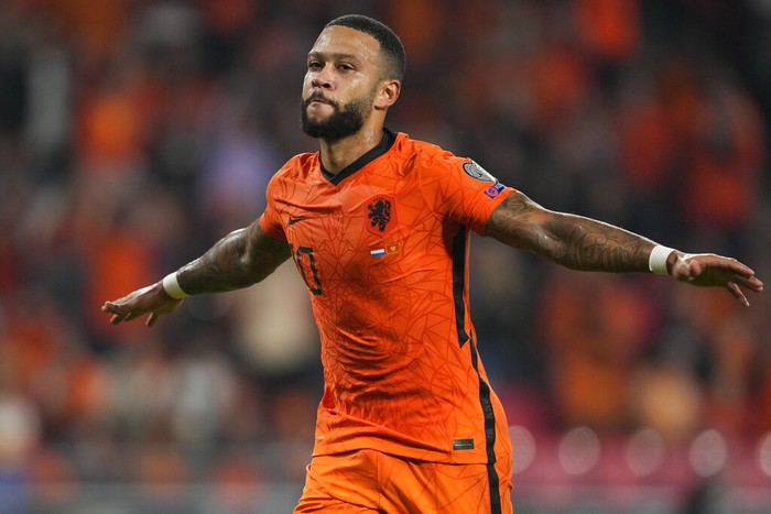 Memphis Depay of the Netherlands celebrates scoring his sides first goal during the World Cup 2022 group G qualifying soccer match between the Netherlands and Montenegro at the Philips stadium in Eindhoven, Netherlands, Saturday, Sept. 4, 2021. (AP Photo/Peter Dejong)