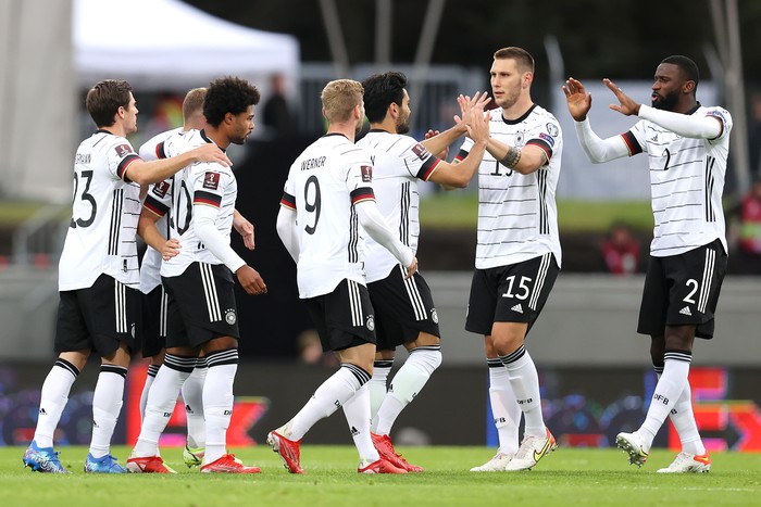 REYKJAVIK, ICELAND - SEPTEMBER 08: Serge Gnabry of Germany celebrates with and team mates after scoring their sides first goal during the 2022 FIFA World Cup Qualifier match between Iceland and Germany at Laugardalsvollur National Stadium on September 08, 2021 in Reykjavik, Iceland. (Photo by Alex Grimm/Getty Images)