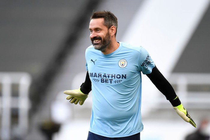 NEWCASTLE UPON TYNE, ENGLAND - MAY 14: Scott Carson of Manchester City warms up prior to the Premier League match between Newcastle United and Manchester City at St. James Park on May 14, 2021 in Newcastle upon Tyne, England. Sporting stadiums around the UK remain under strict restrictions due to the Coronavirus Pandemic as Government social distancing laws prohibit fans inside venues resulting in games being played behind closed doors.  (Photo by Peter Powell - Pool/Getty Images)