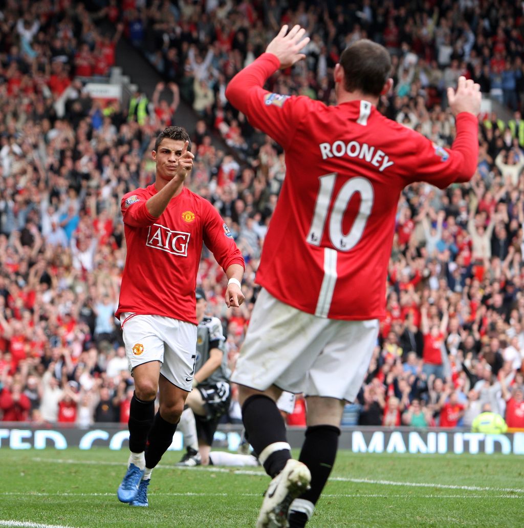 MANCHESTER, UNITED KINGDOM - OCTOBER 06:  Cristiano Ronaldo of Manchester United celebrates scoring his second with Wayne Rooney during the Barclays Premier League match between Manchester United and Wigan Athletic at Old Trafford on October 06, 2007 in Manchester, England.  (Photo by Phil Cole/Getty Images)