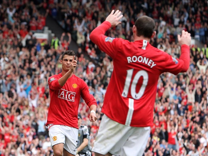 MANCHESTER, UNITED KINGDOM - OCTOBER 06:  Cristiano Ronaldo of Manchester United celebrates scoring his second with Wayne Rooney during the Barclays Premier League match between Manchester United and Wigan Athletic at Old Trafford on October 06, 2007 in Manchester, England.  (Photo by Phil Cole/Getty Images)