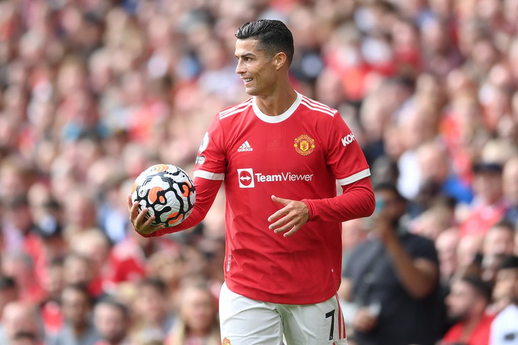 MANCHESTER, ENGLAND - SEPTEMBER 11: Cristiano Ronaldo of Manchester United reacts as he holds the match ball during the Premier League match between Manchester United and Newcastle United at Old Trafford on September 11, 2021 in Manchester, England. (Photo by Laurence Griffiths/Getty Images)