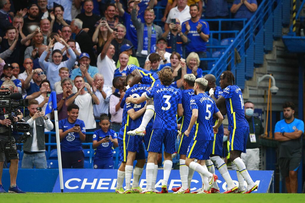 Chelsea players celebrate after Chelsea's Mateo Kovacic scored his side's second goal during the English Premier League match between Chelsea and Aston Villa at the Stamford Bridge Stadium in London, Saturday, Sept. 11, 2021. (AP Photo/Ian Walton)