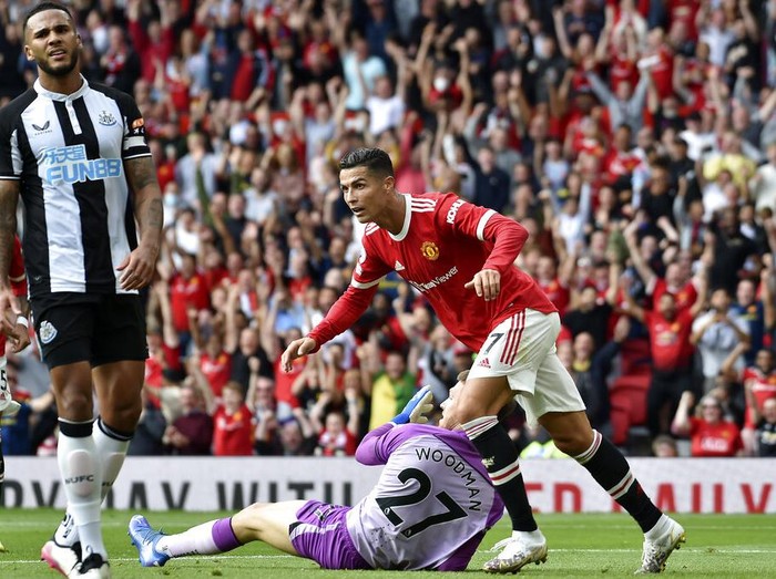 Manchester Uniteds Cristiano Ronaldo celebrates after scoring the opening goal during the English Premier League soccer match between Manchester United and Newcastle United at Old Trafford stadium in Manchester, England, Saturday, Sept. 11, 2021. (AP Photo/Rui Vieira)
