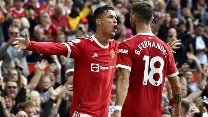 Manchester Uniteds Cristiano Ronaldo celebrates after scoring the opening goal during the English Premier League soccer match between Manchester United and Newcastle United at Old Trafford stadium in Manchester, England, Saturday, Sept. 11, 2021. (AP Photo/Rui Vieira)