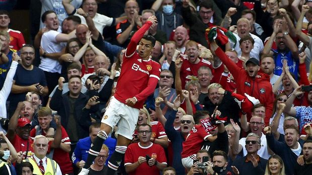 Manchester United's Cristiano Ronaldo celebrates after scoring his side's second goal during the English Premier League soccer match between Manchester United and Newcastle United at Old Trafford stadium in Manchester, England, Saturday, Sept. 11, 2021. (AP Photo/Rui Vieira)