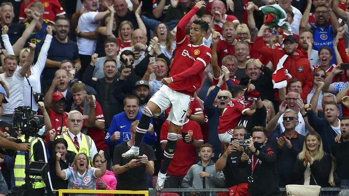 Manchester Uniteds Cristiano Ronaldo celebrates after scoring his sides second goal during the English Premier League soccer match between Manchester United and Newcastle United at Old Trafford stadium in Manchester, England, Saturday, Sept. 11, 2021. (AP Photo/Rui Vieira)