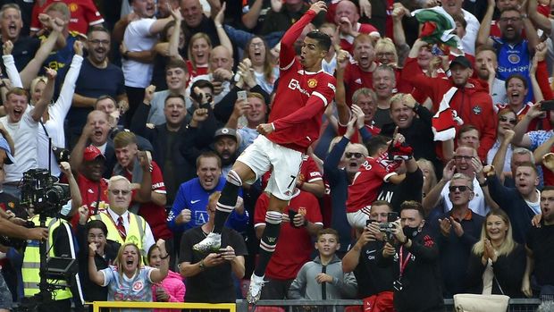 Manchester United's Cristiano Ronaldo celebrates after scoring his side's second goal during the English Premier League soccer match between Manchester United and Newcastle United at Old Trafford stadium in Manchester, England, Saturday, Sept. 11, 2021. (AP Photo/Rui Vieira)