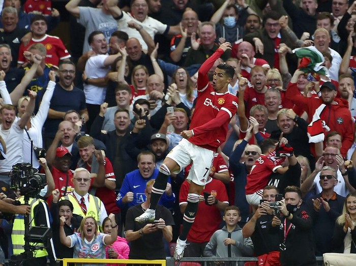 Manchester United's Cristiano Ronaldo celebrates after scoring his side's second goal during the English Premier League soccer match between Manchester United and Newcastle United at Old Trafford stadium in Manchester, England, Saturday, Sept. 11, 2021. (AP Photo/Rui Vieira)
