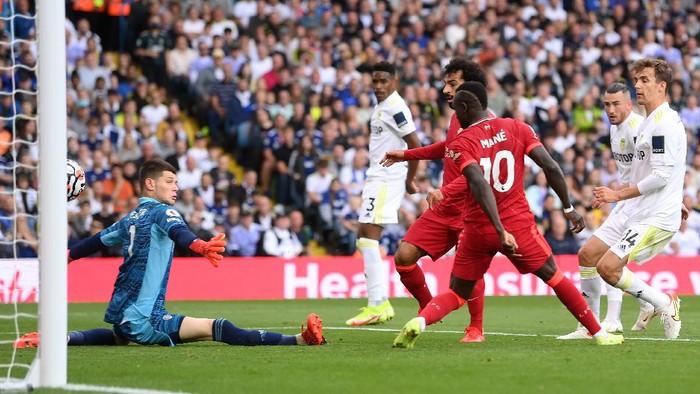 LEEDS, ENGLAND - SEPTEMBER 12: Mohamed Salah of Liverpool scores their sides first goal past Illan Meslier of Leeds United during the Premier League match between Leeds United and Liverpool at Elland Road on September 12, 2021 in Leeds, England. (Photo by Laurence Griffiths/Getty Images)