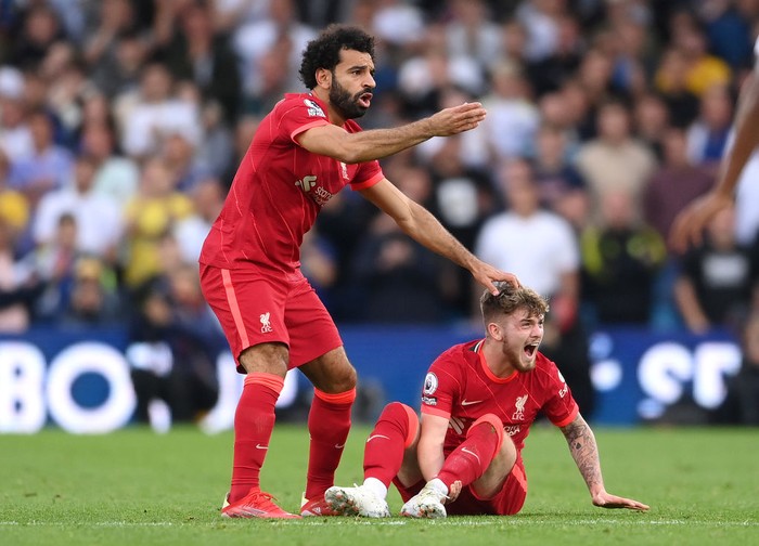 LEEDS, ENGLAND - SEPTEMBER 12: Harvey Elliott of Liverpool receives medical treatment during the Premier League match between Leeds United and Liverpool at Elland Road on September 12, 2021 in Leeds, England. (Photo by Laurence Griffiths/Getty Images)