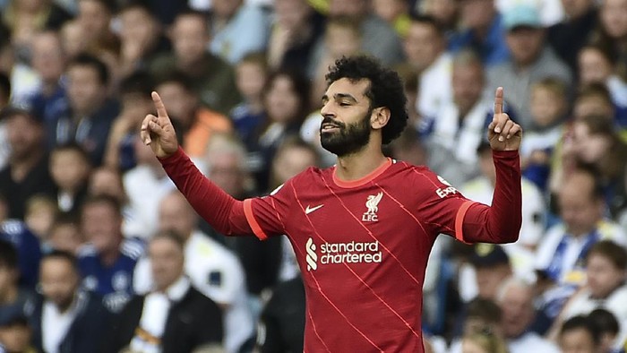 Liverpools Mohamed Salah celebrates after scoring the opening goal during the English Premier League soccer match between Leeds United and Liverpool at Elland Road, Leeds, England, Sunday, Sept. 12, 2021. (AP Photo/Rui Vieira)