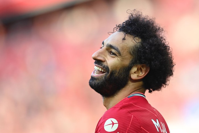 LIVERPOOL, ENGLAND - AUGUST 28: Mohamed Salah of Liverpool smiles during the Premier League match between Liverpool  and  Chelsea at Anfield on August 28, 2021 in Liverpool, England. (Photo by Michael Regan/Getty Images)