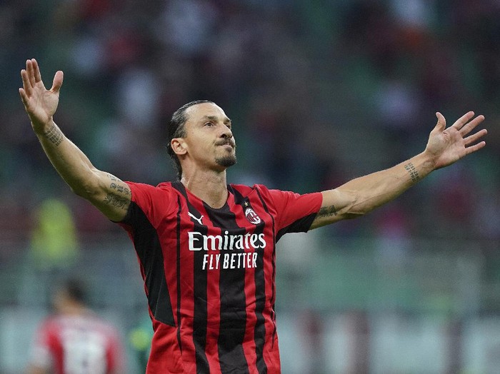 Milan's Zlatan Ibrahimovic celebrates after scoring  his side's seconf goal during the Italian Serie A soccer match between Milan and Lazio at the San Siro stadium in Milan, Italy, Sunday, Sept. 12, 2021. (Spada/LaPresse via AP)