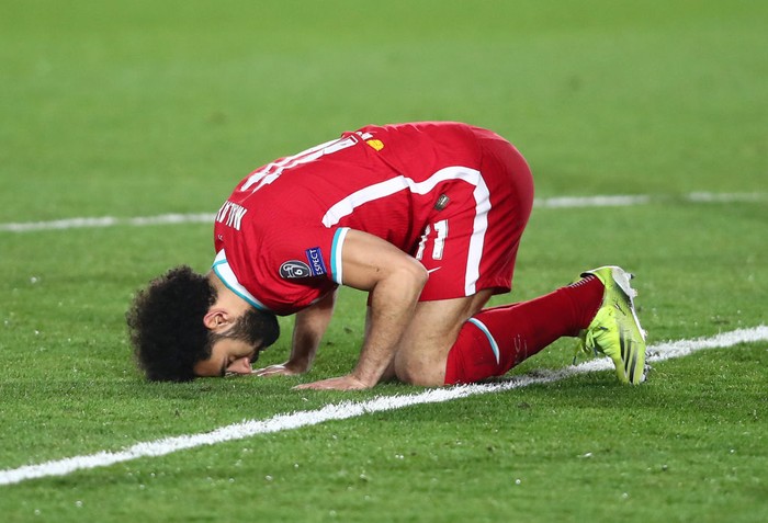 MADRID, SPAIN - APRIL 06: Mohamed Salah of Liverpool celebrates after scoring their teams first goal during the UEFA Champions League Quarter Final match between Real Madrid and Liverpool FC at Estadio Alfredo Di Stefano on April 06, 2021 in Madrid, Spain. Sporting stadiums around Spain remain under strict restrictions due to the Coronavirus Pandemic as Government social distancing laws prohibit fans inside venues resulting in games being played behind closed doors. (Photo by Fran Santiago/Getty Images)