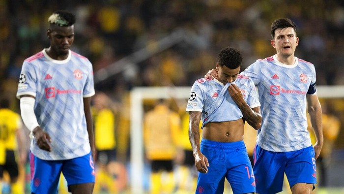 From left, Manchester Uniteds Paul Pogba, Jesse Lingard and Harry Maguire leave the pitch after of the Champions League group F soccer match between BSC Young Boys and Manchester United, at the Wankdorf stadium in Bern, Switzerland, Tuesday, Sept. 14, 2021. (Peter Klaunzer/Keystone via AP)