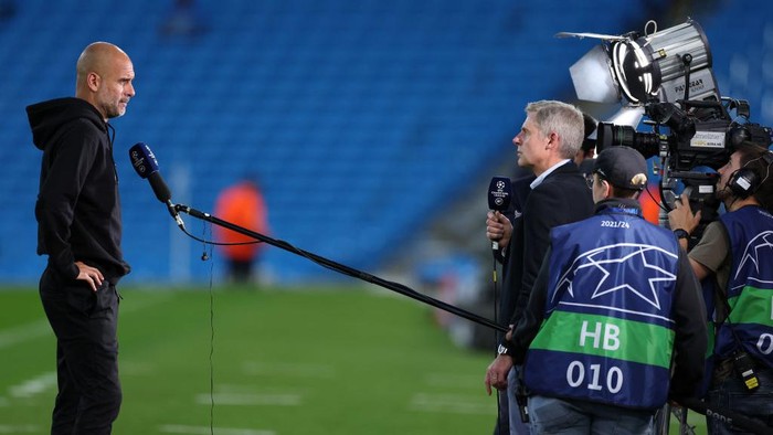 MANCHESTER, ENGLAND - SEPTEMBER 15: Pep Guardiola, Manager of Manchester City speaks during an interview prior to the UEFA Champions League group A match between Manchester City and RB Leipzig at Etihad Stadium on September 15, 2021 in Manchester, England. (Photo by Richard Heathcote/Getty Images)
