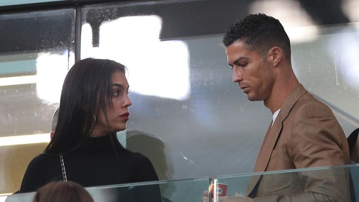 TURIN, ITALY - OCTOBER 02:  Cristiano Ronaldo and Georgina Rodriguez are seen during the Group H match of the UEFA Champions League between Juventus and BSC Young Boys at Allianz Stadium on October 2, 2018 in Turin, Italy.  (Photo by Emilio Andreoli/Getty Images)