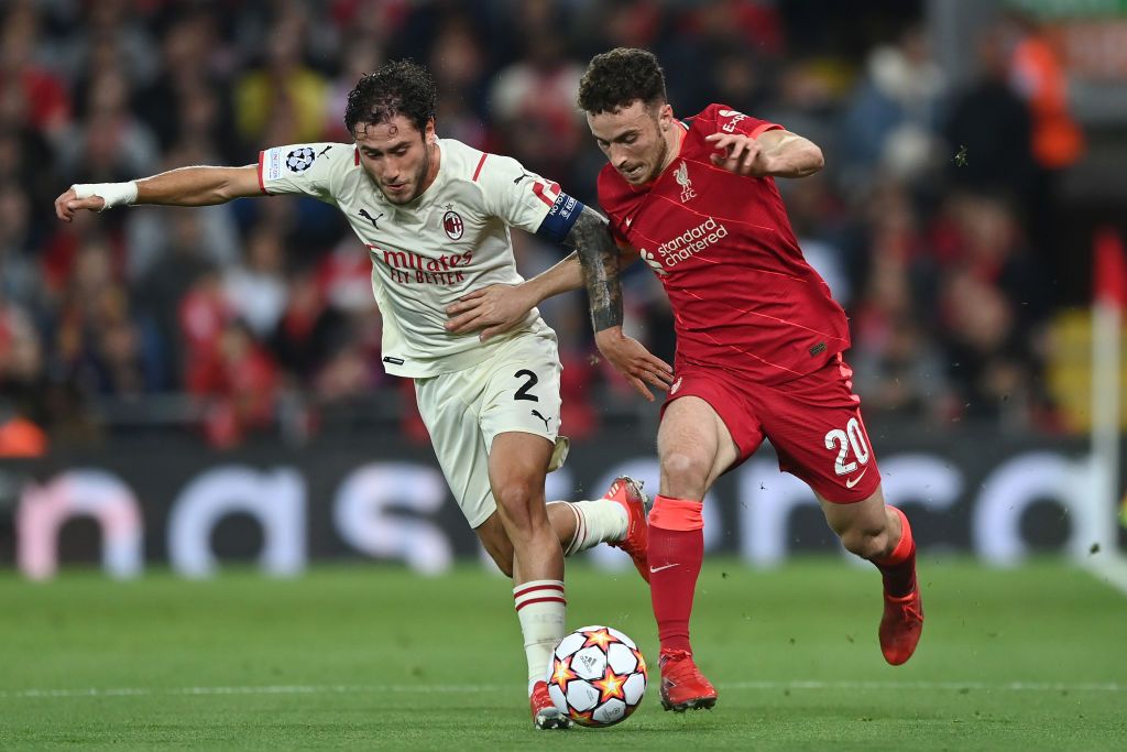 LIVERPOOL, ENGLAND - SEPTEMBER 15: Davide Calabria of AC Milan battles for possession with Diogo Jota of Liverpool during the UEFA Champions League group B match between Liverpool FC and AC Milan at Anfield on September 15, 2021 in Liverpool, England. (Photo by Shaun Botterill/Getty Images)