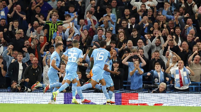 MANCHESTER, ENGLAND - SEPTEMBER 15: Nathan Ake of Manchester City celebrates after scoring their sides first goal during the UEFA Champions League group A match between Manchester City and RB Leipzig at Etihad Stadium on September 15, 2021 in Manchester, England. (Photo by Richard Heathcote/Getty Images)