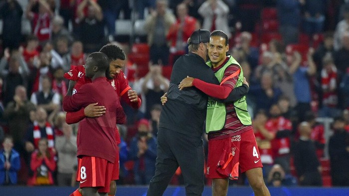 Liverpools Virgil van Dijk embraces Liverpools manager Jurgen Klopp at the end of the Champions League Group B soccer match between Liverpool and AC Milan at Anfield, in Liverpool, England, Wednesday Sept. 15, 2021. Liverpool won the match 3-2. (AP Photo/Rui Vieira)
