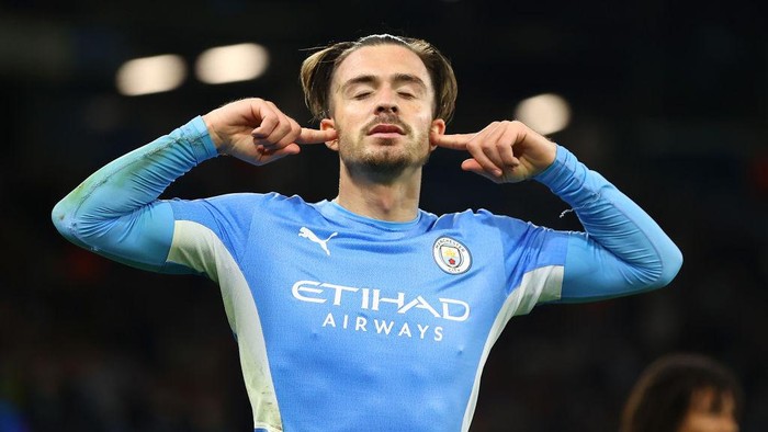 MANCHESTER, ENGLAND - SEPTEMBER 15: Jack Grealish of Manchester City celebrates after scoring their sides fourth goal during the UEFA Champions League group A match between Manchester City and RB Leipzig at Etihad Stadium on September 15, 2021 in Manchester, England. (Photo by Michael Steele/Getty Images)