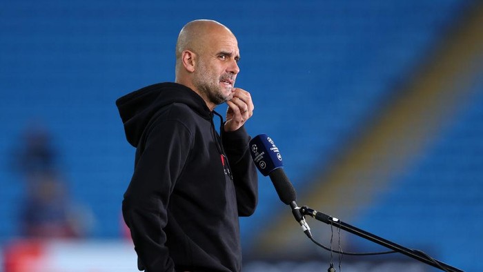 MANCHESTER, ENGLAND - SEPTEMBER 15: Pep Guardiola, Manager of Manchester City speaks during an interview prior to the UEFA Champions League group A match between Manchester City and RB Leipzig at Etihad Stadium on September 15, 2021 in Manchester, England. (Photo by Richard Heathcote/Getty Images)