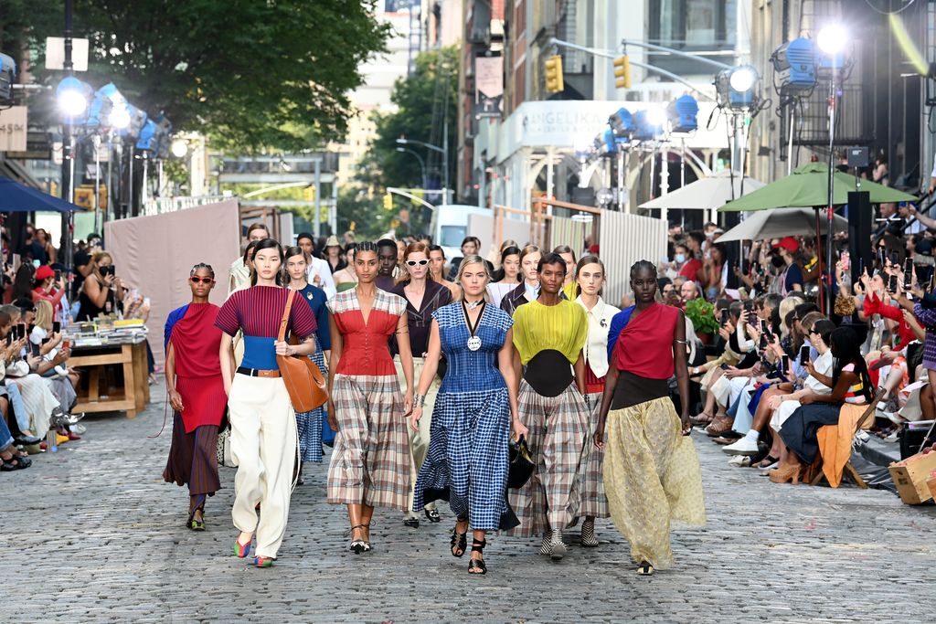 NEW YORK, NEW YORK - SEPTEMBER 12: Models walk the runway during the Tory Burch Spring/Summer 2022 Collection & Mercer Street Block Party on September 12, 2021 in New York City. (Photo by Slaven Vlasic/Getty Images for Tory Burch)