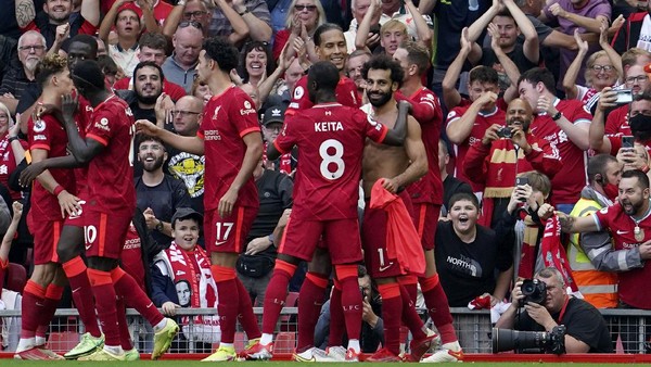 Liverpools Mohamed Salah, right, celebrates after scoring his sides second goal during the English Premier League soccer match between Liverpool and Crystal Palace at Anfield Stadium, Liverpool, England, Saturday Sep. 18, 2021. (AP Photo/Jon Super)