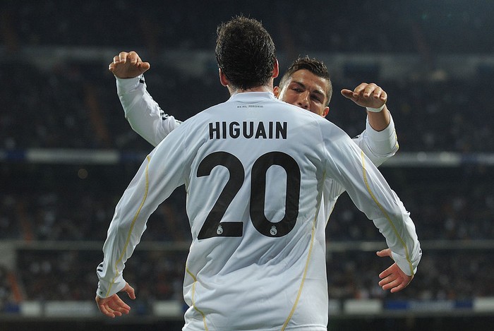 MADRID, SPAIN - APRIL 18:  Gonzalo Higuain of Real Madrid celebrates with Cristiano Ronaldo after scoring Reals first goal during the La Liga match between Real Madrid and Valencia at Estadio Santiago Bernabeu on April 18, 2010 in Madrid, Spain.  (Photo by Denis Doyle/Getty Images)