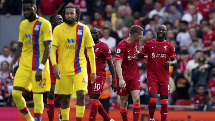 Liverpools Naby Keita, right, celebrates after scoring his sides third goal during the English Premier League soccer match between Liverpool and Crystal Palace at Anfield Stadium, Liverpool, England, Saturday Sep. 18, 2021. (AP Photo/Jon Super)