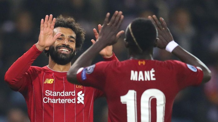 GENK, BELGIUM - OCTOBER 23: Mohamed Salah of Liverpool celebrates with teammate Sadio Mane after scoring his teams fourth goal during the UEFA Champions League group E match between KRC Genk and Liverpool FC at Luminus Arena on October 23, 2019 in Genk, Belgium. (Photo by Catherine Ivill/Getty Images)