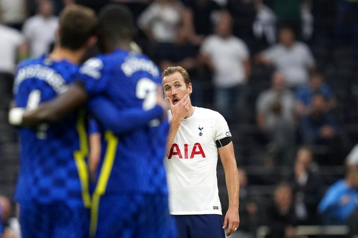 Tottenhams Harry Kane, center, reacts as Chelseas Antonio Rudiger, foreground with number 2, celebrates after scoring his sides third goal during the English Premier League soccer match between Tottenham Hotspur and Chelsea at the Tottenham Hotspur Stadium in London, England, Sunday, Sep. 19, 2021. (AP Photo/Matt Dunham)
