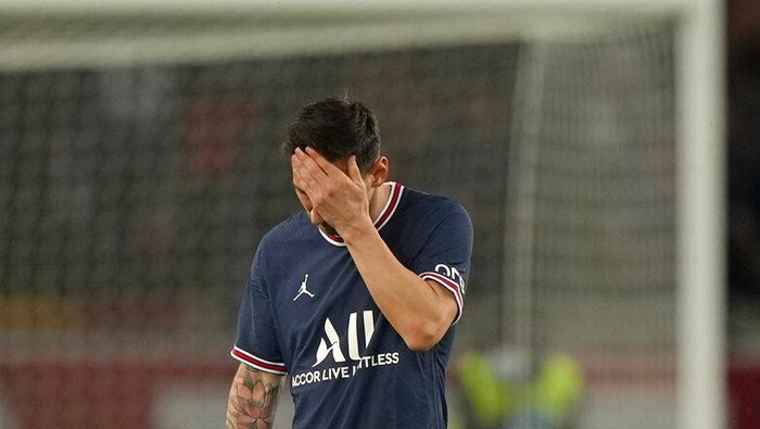 PSGs Lionel Messi reacts after Lyons Lucas Paqueta scored the opening goal during the French League One soccer match between Paris Saint-Germain and Lyon at the Parc des Princes in Paris Sunday, Sept. 19, 2021. (AP Photo/Francois Mori)
