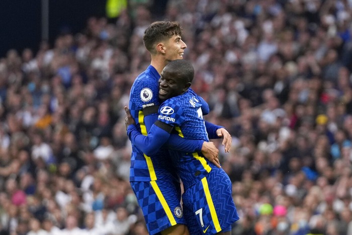 Chelseas NGolo Kante celebrates with Kai Havertz, left, after scoring his sides second goal during the English Premier League soccer match between Tottenham Hotspur and Chelsea at the Tottenham Hotspur Stadium in London, England, Sunday, Sep. 19, 2021. (AP Photo/Matt Dunham)