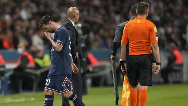 PSG's Lionel Messi looks down after he was substituted during the French League One soccer match between Paris Saint-Germain and Lyon at the Parc des Princes in Paris Sunday, Sept. 19, 2021. (AP Photo/Francois Mori)