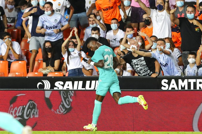 Real Madrids Vinicius Junior celebrates after scoring his sides first goal during a Spanish La Liga soccer match between Valencia and Real Madrid at the Mestalla stadium in Valencia, Spain, Sunday, Sept. 19, 2021. (AP Photo/Alberto Saiz)