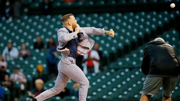 Sep 21, 2021; Chicago, Illinois, USA; MMA fighter Conor McGregor throws out a ceremonial first pitch before the game between the Chicago Cubs and the Minnesota Twins at Wrigley Field. Mandatory Credit: Jon Durr-USA TODAY Sports