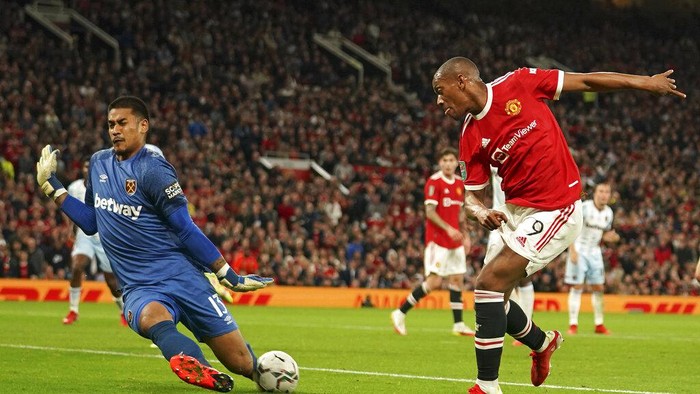 Manchester Uniteds Anthony Martial, left, misses a chance during the English League Cup soccer match between Manchester United and West Ham at Old Trafford in Manchester, England, Wednesday, Sept. 22, 2021. (AP Photo/Dave Thompson)