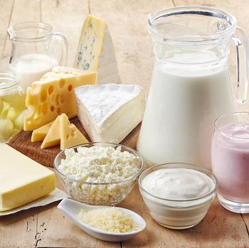 Various fresh dairy products on wooden background