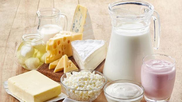 Various fresh dairy products on wooden background