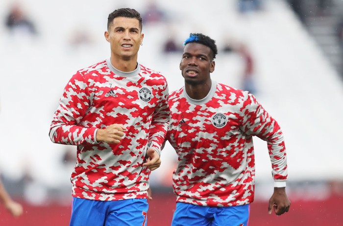 LONDON, ENGLAND - SEPTEMBER 19: Cristiano Ronaldo of Manchester United is seen warming up with Paul Pogba of Manchester United prior to the Premier League match between West Ham United and Manchester United at London Stadium on September 19, 2021 in London, England. (Photo by Julian Finney/Getty Images)