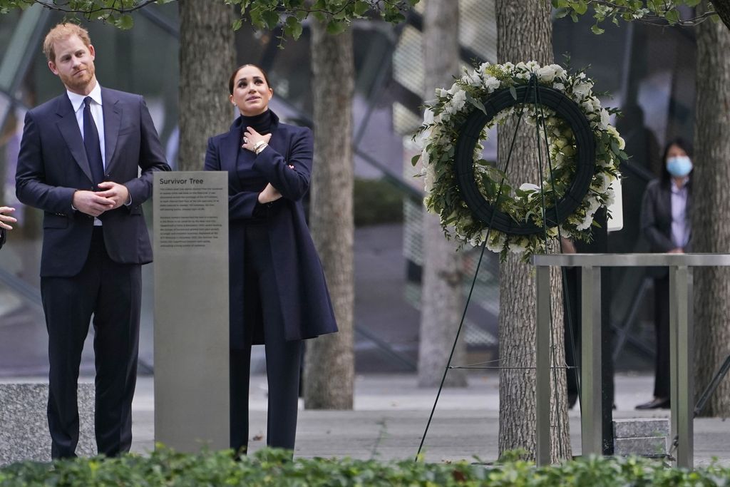 Meghan Markle and Prince Harry pause while getting a tour of the National September 11 Memorial & Museum in New York, Thursday, Sept. 23, 2021. The Duke and Duchess of Sussex got a hawk's-eye view of New York City with a visit to the rebuilt World Trade Center's signature tower. (AP Photo/Seth Wenig)