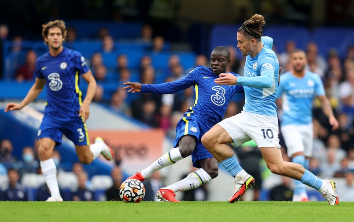 LONDON, ENGLAND - SEPTEMBER 25: Ngolo Kante of Chelsea tackles Jack Grealish of Manchester City during the Premier League match between Chelsea and Manchester City at Stamford Bridge on September 25, 2021 in London, England. (Photo by Catherine Ivill/Getty Images)