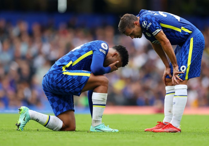 LONDON, ENGLAND - SEPTEMBER 25: Cesar Azpilicueta of Chelsea interacts with Reece James of Chelsea who is down injured  during the Premier League match between Chelsea and Manchester City at Stamford Bridge on September 25, 2021 in London, England. (Photo by Catherine Ivill/Getty Images)