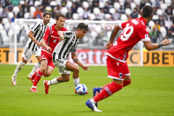 Juventus' Paulo Dybala leaves the pitch after suffering an injury during the Italian Serie A soccer match between Juventus and Sampdoria, in Turin, Italy, Sunday, Sept. 26, 2021. (Marco Alpozzi/LaPresse via AP)