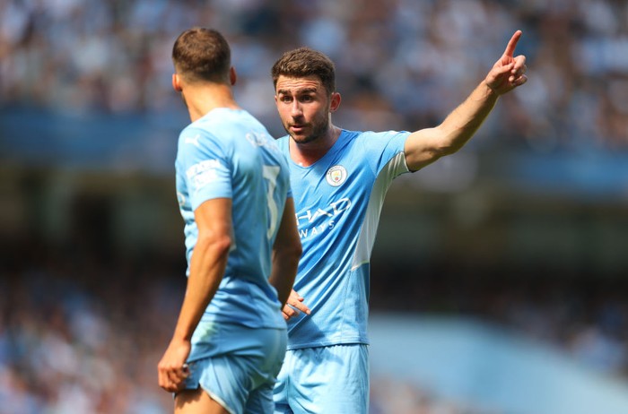 MANCHESTER, ENGLAND - AUGUST 28: Aymeric Laporte of Manchester City talks to Ruben Dias of Manchester City during the Premier League match between Manchester City  and  Arsenal at Etihad Stadium on August 28, 2021 in Manchester, England. (Photo by Catherine Ivill/Getty Images)