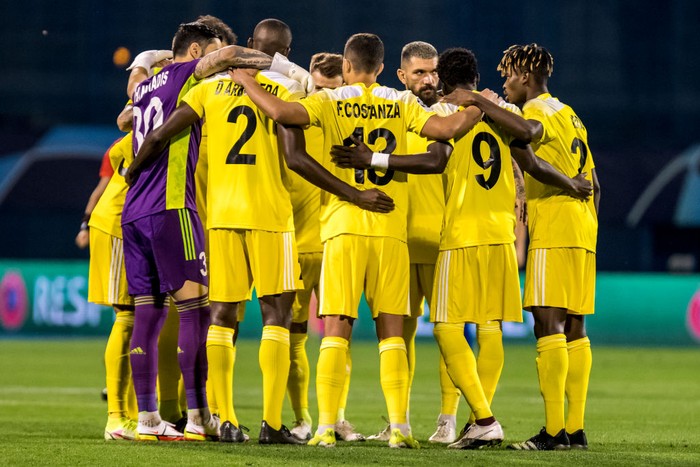 ZAGREB, CROATIA - AUGUST 25: Players of FC Sheriff embrace before the UEFA Champions League Play-Offs Leg Two match between Dinamo Zagreb and FC Sheriff at Maksimir Stadium on August 25, 2021 in Zagreb, Croatia. (Photo by Jurij Kodrun/Getty Images)